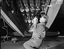 Mosquito photo-reconnaissance photoflash bomb loading WWII IWM C 4998.jpg